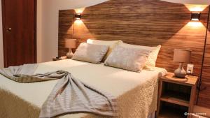Cama ou camas em um quarto em Terra dos Diamantes Hotel