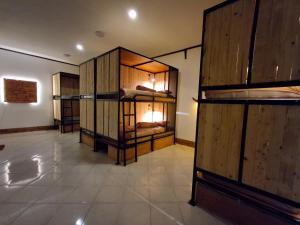 a room with a bunch of bunk beds in it at Nglinteg Hostel in Yogyakarta