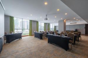 a conference room with tables and chairs in a building at Park Inn by Radisson Istanbul Asia Kavacik in Istanbul