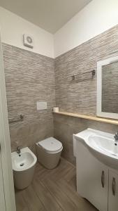 a bathroom with a toilet and a sink at B&B Dimora Elmara in San Salvo