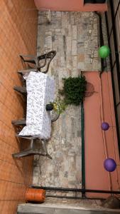 a bike hanging on the side of a wall at Casa dos avós in Redondela +3 photos