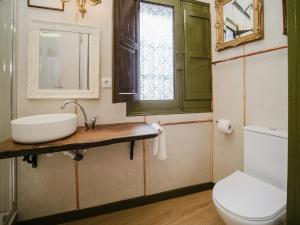 a bathroom with a sink and a toilet at La Casa 1832 Boutique in Sanlúcar de Barrameda +117 photos