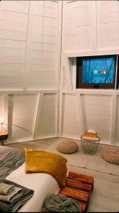 a room with a bed and a tv in a room at Glamping The Teepee in Mombeltrán