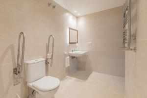 a bathroom with a toilet and a sink at Zelaikoa Behekoa - baskeyrentals in Zestoa +26 photos