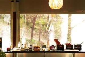 a kitchen counter with food on a window sill at Glamping The Teepee in Mombeltrán +35 photos