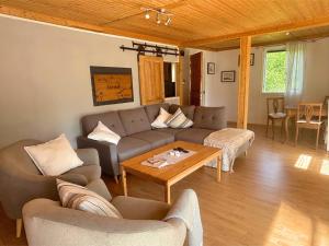 a living room with a couch and a table at Villa Bela in Högsby