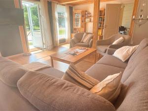 a living room with a couch and a table at Villa Bela in Högsby