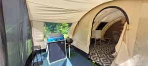 a tent with a tv inside of it at De Zanglijster in Erica