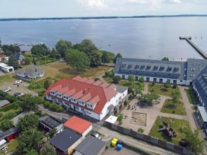 an aerial view of a city with a large building and the water at Bugoase in Dranske