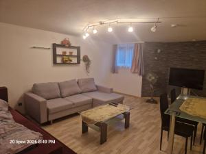 a living room with a couch and a table at Justyna-Sebastian FE-WO in Paderborn