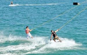 two people are water skiing in the ocean at Studio 3 apartmani Braut in Kornić