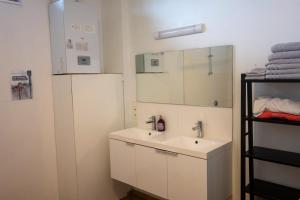 a bathroom with a sink and a mirror at LE PARADIS ATHOIS in Ath +47 photos