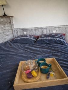 a tray with a tray of food on a bed at Breg&Spa in Beretinec