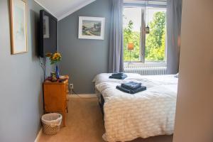 a bedroom with a bed and a window at Villa Storfors in Storfors