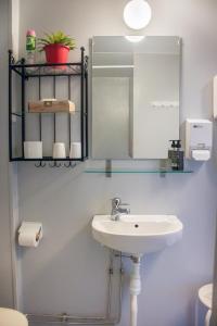 a bathroom with a sink and a mirror at Villa Storfors in Storfors