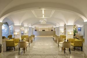a lobby with chairs and a waiting room at Hotel Shangri-La Roma by OMNIA hotels in Rome