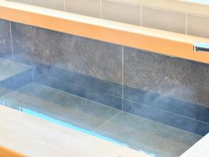 a blue and orange bench with smoke coming out at NEW OPEN! Villa Piesta in Atami +22 photos