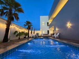 a swimming pool in the middle of a house at LaViena pool villa in Vientiane