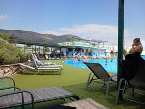 a group of people in a swimming pool at Irena Apartment near Aqua Park in Trebinje