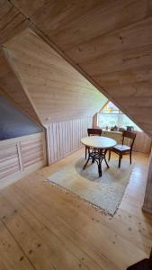 an attic room with a table and a table sidx sidx sidx sidx at Countryhome apartment in Jõõpre