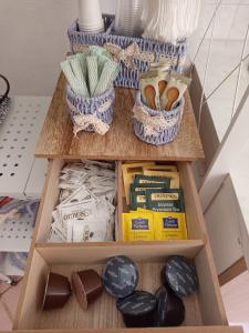 a shelf with food and other items on it at Curtigghiu Room in Avola