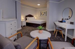 a bedroom with a bed and a table and a desk at Best Western Stoke on Trent City Centre Hotel in Stoke on Trent +69 photos