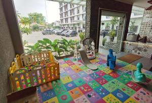 a childs play area with a toy on a table at Grand Central Medan in Medan