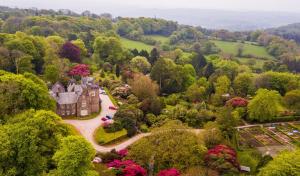 an aerial view of a castle in the trees at The Clock House in Harford