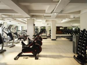 a gym with rows of exercise bikes and treadmills at The Mont in Dublin