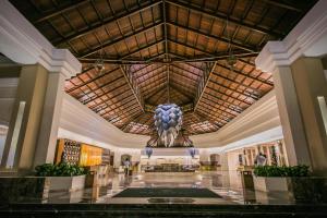 a large ornate building with a clock on the ceiling at Majestic Mirage Punta Cana, All Suites – All Inclusive in Punta Cana