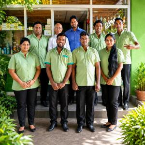 a group of people standing in front of a building at Sky and Sand Guesthouse in Beruwala +180 photos