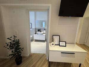 a bathroom with a white counter and a sink at Zum Weinkrug - Apartments in Vienna +53 photos