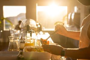 a person is preparing food in a kitchen at Hotel El Patio in Garachico +55 photos
