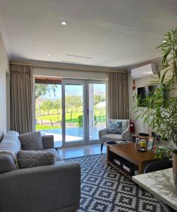 a living room with a couch and a table at Mon Rêve Estate in Cape Town