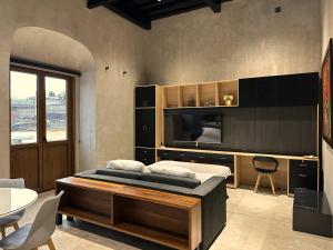 a bedroom with a bed and a table and chairs at Casa 1800 Oaxaca Boutique Hotel in Oaxaca City