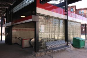 a bench sitting in front of a building at West Broadway Quarters by Thatch in Boston