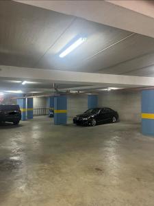 a parking garage with two cars parked in it at Étoile Batroun in Batroûn +9 photos