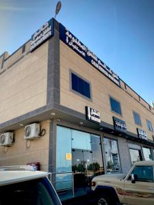 a building with a car parked in front of it at شقق كالم للشقق المخدومة 1 in Riyadh
