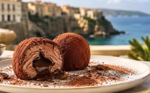 a chocolate cake on a plate on a table at Gioia Casa in Pizzo