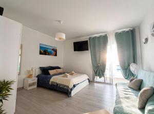 a bedroom with a bed and a couch at Dream Ocean Sunset in Playa Paraiso +18 photos