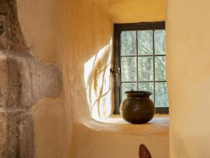 a vase sitting on a window sill in a room at Braidwood Castle - Uk10672 in Braidwood