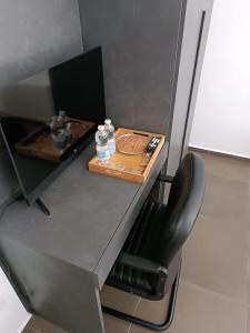 a table with a chair and a plate of food on it at CIVICO 14 Holiday Rooms in Suzzara