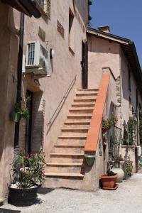 a set of stairs in a building with potted plants at Il Casaletto del Terminillo in Rieti