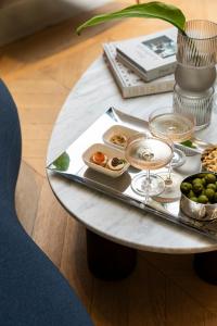 a table with a tray of food on it at Casa Laveni in Milan