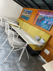 a row of tables and chairs in a room at Ursulino Valletta in Valletta
