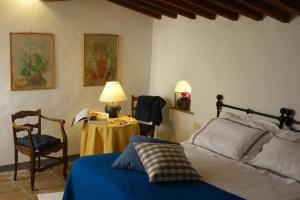 Katil atau katil-katil dalam bilik di Fattoria Casa Sola