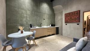 a living room with a table and a sink at Casa 1800 Oaxaca Boutique Hotel in Oaxaca City +279 photos