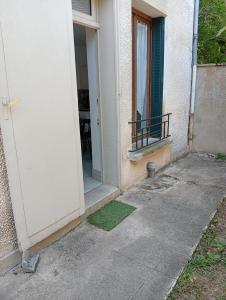 an open door of a building with a porch at Fernand Villard in La Souterraine