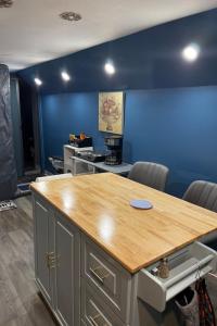 a conference room with a table and a blue wall at Maxis-place in Jersey City