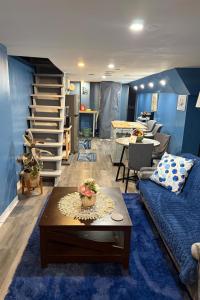 a living room with a couch and a table at Maxis-place in Jersey City